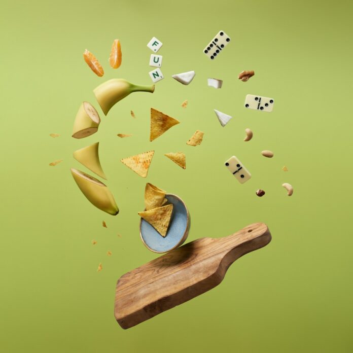 a wooden board topped with lots of different types of food