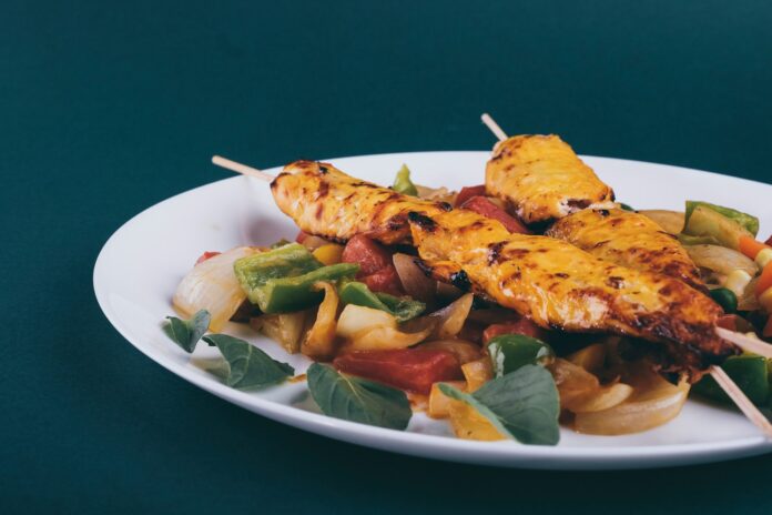 Photo by Sam Moghadam fried food on white ceramic plate