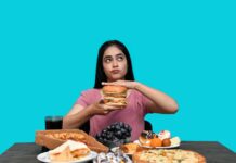 “먹어도 배고픈 이유?” — 스트레스성 폭식의 뇌 과학 a woman holding a burger